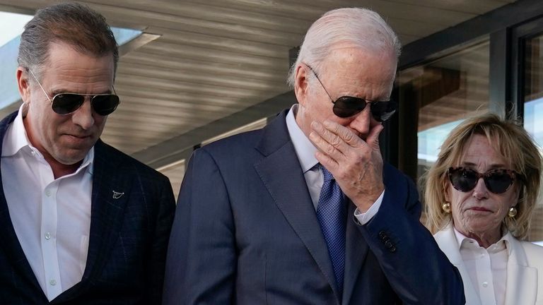 President Joe Biden stands with his son Hunter Biden, left, and sister Valerie Biden Owens, right, as he looks at a plaque dedicated to his late son Beau Biden while visiting Mayo Roscommon Hospice in County Mayo, Ireland, Friday, April 14, 2023. (AP Photo/Patrick Semansky)