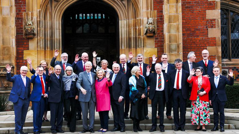 Former U.S. President Bill Clinton, former U.S. Senator George Mitchell, former U.S. Secretary of State Hillary Clinton and former Irish Prime Minister (Taoiseach) Bertie Ahern pose with signatories during an event marking the 25th anniversary of the Belfast/Good Friday Agreement at Queens University, in Belfast, Northern Ireland, April 17, 2023. REUTERS/Clodagh Kilcoyne