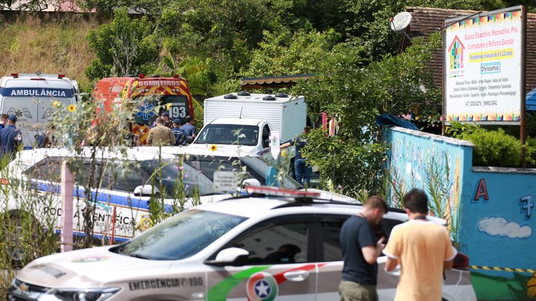 A view shows forensic technicians, ambulances and policemen outside a pre-school after a 25-year-old man attacked children, killing several and injuring others, according to local police and hospital, in Blumenau, in the southern Brazilian state of Santa Catarina, Brazil April 5, 2023. REUTERS/Denner Ovidio NO RESALES. NO ARCHIVES