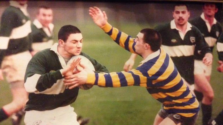 Neil playing rugby when he was younger