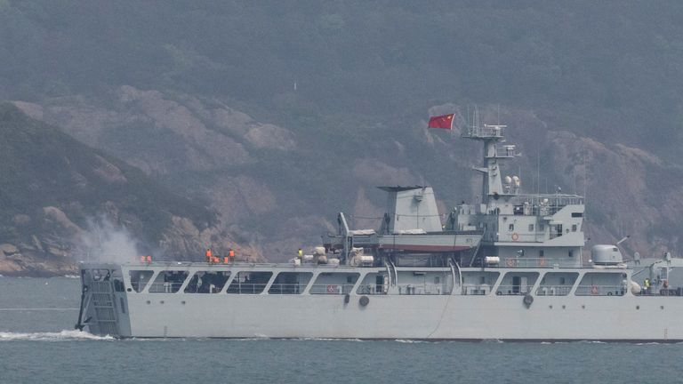 A Chinese warship fires towards the shore during a military drill near the Taiwan-controlled Matsu Islands that are close to the Chinese coast