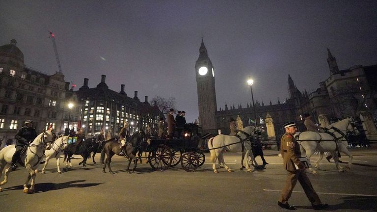 Members of the military on the Mall outside Buckingham Palace, central London, during a night time rehearsal for the coronation