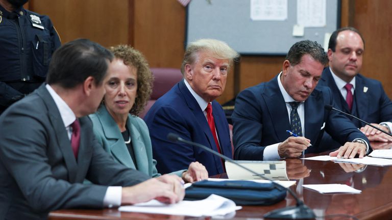 Former U.S. President Donald Trump appears in court for an arraignment on charges stemming from his indictment by a Manhattan grand jury following a probe into hush money paid to porn star Stormy Daniels, in New York City, U.S., April 4, 2023. REUTERS/Andrew Kelly/Pool
