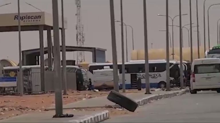 Hundreds of buses carrying people escaping Khartoum and other places affected by fighting are arriving at Egyptian border crossings. Pic: AP / Marwa al-Sayed