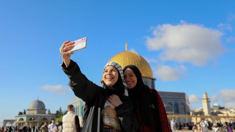 Palestinian women take a selfie together following Eid al-Fitr prayers at the compound that houses al-Aqsa mosque, known to Muslims as Noble Sanctuary and to Jews as Temple Mount in Jerusalem&#39;s Old City, April 21, 2023. REUTERS/Jamal Awad NO RESALES. NO ARCHIVES
