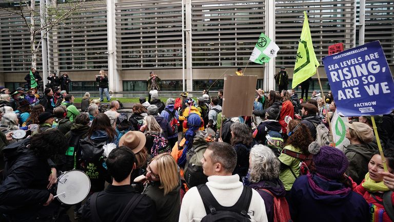 Extinction Rebellion demonstrators take part in a protest outside the ...