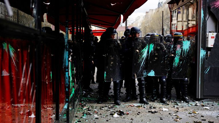 French CRS riot police secure a position in front of La Rotonde restaurant during clashes with protesters at a demonstration as part of the eleventh day of nationwide strikes and protests against French government&#39;s pension reform, in Paris, France, April 6, 2023.   REUTERS/Sarah Meyssonnier 