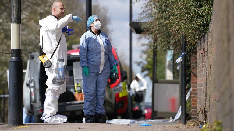 Forensic investigators at scene on Tollgate Road in Beckton, Newham after a fire at a block of flats