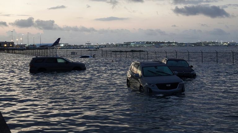Flooding lingers at Fort Lauderdale-Hollywood International Airport on Thursday, April 13, 2023 after heavy rain pounded South Florida on Wednesday. South Florida is keeping a wary eye on a forecast that calls for rain a day after nearly a foot fell in a matter of hours. The rains caused widespread flooding, closed the Fort Lauderdale airport and turned thoroughfares into rivers. (Joe Cavaretta /South Florida Sun-Sentinel via AP)