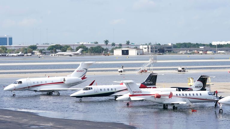 Small planes are parked at Fort Lauderdale- Hollywood International Airport, after the airport was force to shut down due to flooding, Thursday, April 13, 2023, in Fort Lauderdale, Fla. Fort Lauderdale issued a state of emergency as flood conditions continued through many areas. Over 25 inches of rain fell in South Florida since Monday causing widespread flooding. (AP Photo/Marta Lavandier)