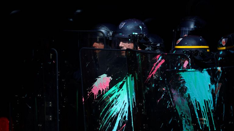 French CRS riot police secure a position in front of La Rotonde restaurant during clashes with protesters at a demonstration as part of the eleventh day of nationwide strikes and protests against French government&#39;s pension reform, in Paris, France, April 6, 2023. REUTERS/Sarah Meyssonnier
