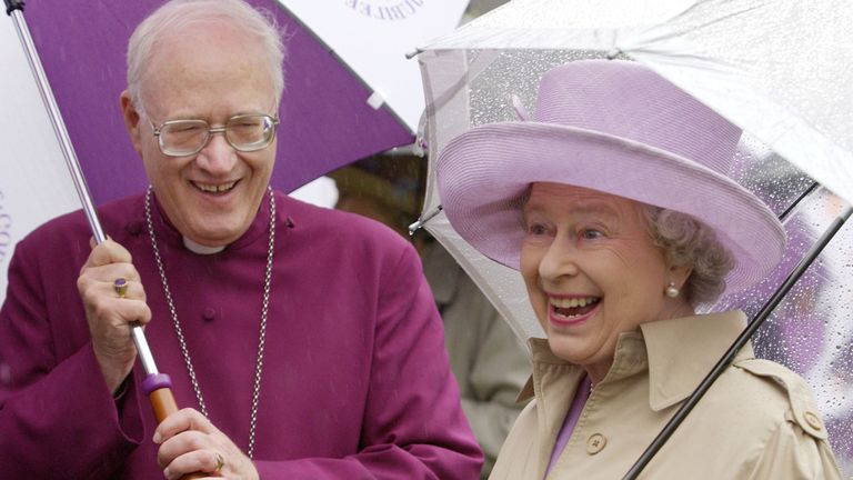 ile photo dated 06/06/2002 of Queen Elizabeth II cheerfully braves heavy rain with the Archbishop of Canterbury, Doctor George Carey, at the Archbishop&#39;s Royal Garden Party in the grounds of his official residence, Lambeth Palace, London. Issue date: Thursday April 20, 2023.