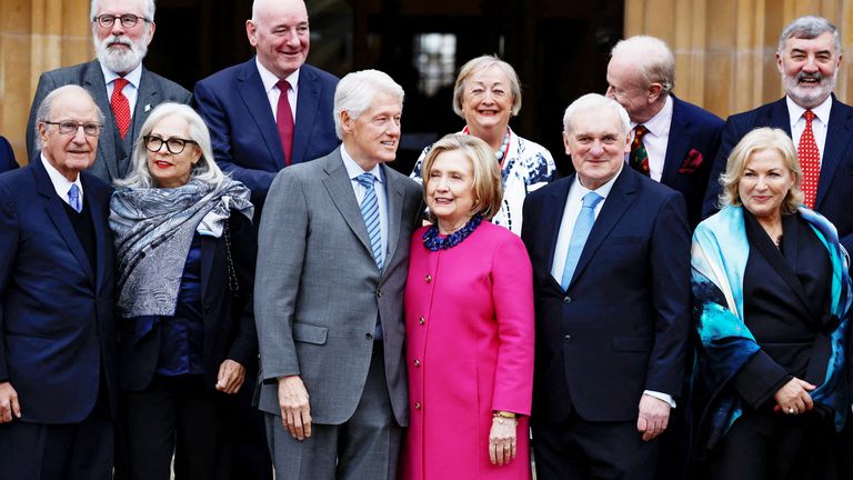 Former US President Bill Clinton and former US Secretary of State Hillary Clinton pose with signatories in Belfast