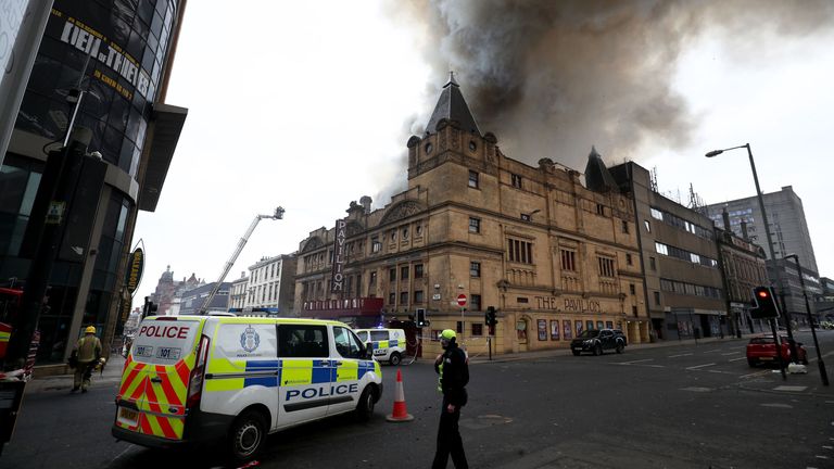 The scene in Glasgow city centre where firefighters are tackling a large blaze on Sauchiehall Street near the junction with Hope Street.