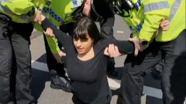 An Animal Rising activist is arrested after the group vowed to prevent the Grand National going ahead.