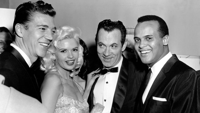 Singer Harry Belafonte, far right, is shown with actress Jayne Mansfield, second from left, her boyfriend Mickey Hargitay, left, and movie columnist Mike Connolly after his opening at the Cocoanut Grove in Los Angeles, Ca., Jan. 31, 1957. (AP Photo)