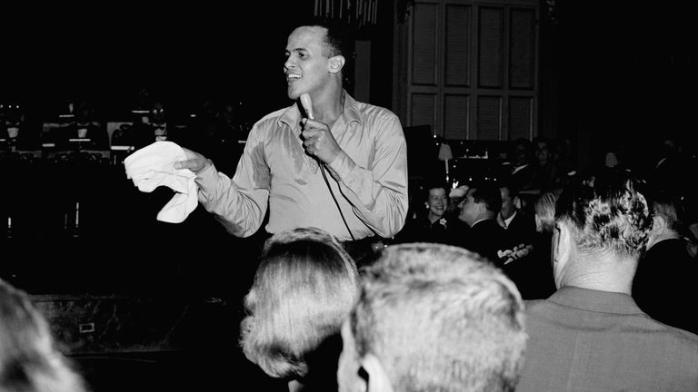 Singer Harry Belafonte is shown Oct.2,1956 during a performance at Waldorf-Astoria Hotel in New York. (AP Photo/Al Lambert)