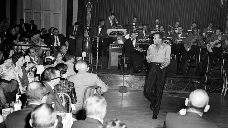 Singer Harry Belafonte is shown Oct.2,1956 during a performance at Waldorf-Astoria Hotel in New York. (AP Photo/Al Lambert)