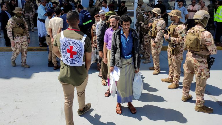 Freed Houthi prisoners stand as they wait to board an International Committee of the Red Cross (ICRC)-chartered plane at Aden Airport, in Aden, Yemen April 14, 2023. REUTERS/Fawaz Salman
