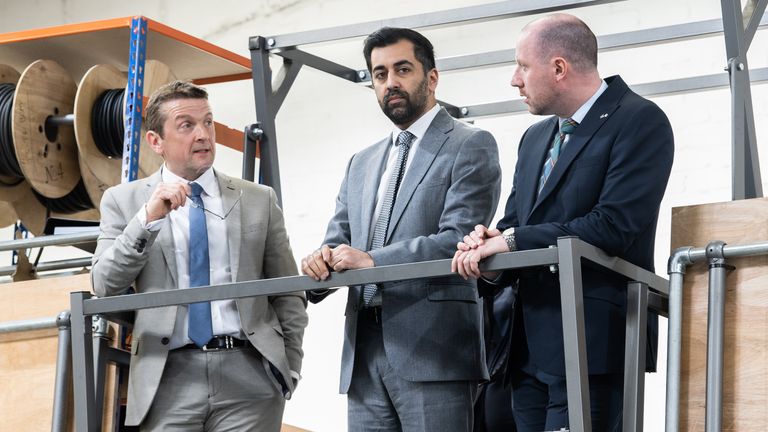 First Minister Humza Yousaf and Energy Secretary Neil Gray (right) alongside CEO Simon Forrest during a visit to tidal energy company Nova Innovation in Edinburgh, to preview a new floating solar panel installation which, when deployed, will be a first for Scotland. Picture date: Tuesday April 11, 2023.
