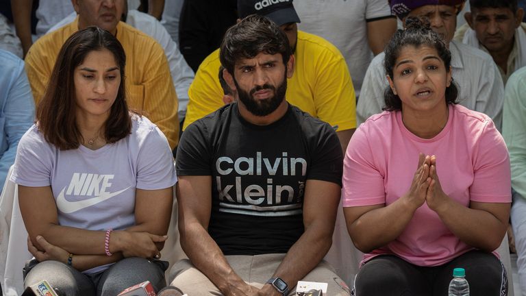 Indian wrestlers Vinesh Phogat, Bajrang Punia, and Sakshi Malik address a news conference as they take part in a sit-in protest demanding arrest of Wrestling Federation of India (WFI) chief, who they accuse of sexually harassing female players, in New Delhi, India, April 24, 2023. REUTERS/Adnan Abidi
