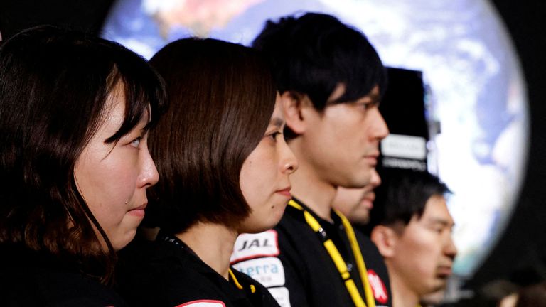 Employees of "ispace" react after the company announced they lost signal from the moon lander