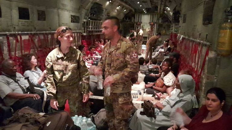 Italian citizens are boarded on an Italian Air Force C130 aircraft during their evacuation from Khartoum, Sudan, in this undated photo obtained by Reuters on April 24, 2023. Ministero della Difesa/Handout via REUTERS ATTENTION EDITORS - THIS IMAGE HAS BEEN SUPPLIED BY A THIRD PARTY. NO ARCHIVES. NO RESALES.
