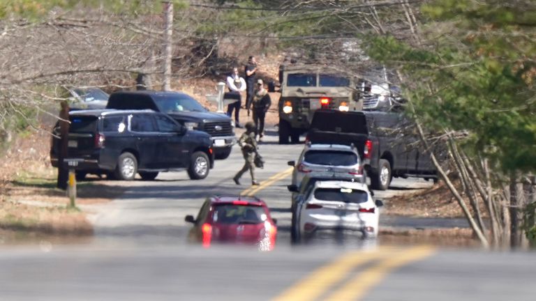 Members of law enforcement assemble on a road,  in Dighton where FBI agents converged on the home of Jack Teixeira
Pic:AP
Pic:AP  