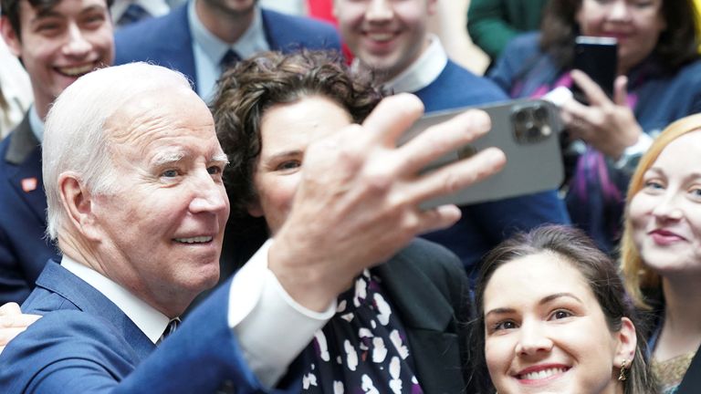 U.S. President Joe Biden poses with students on the 25th anniversary of the Belfast/Good Friday Agreement, at Ulster University, Belfast, Northern Ireland April 12, 2023. REUTERS/Kevin Lamarque
