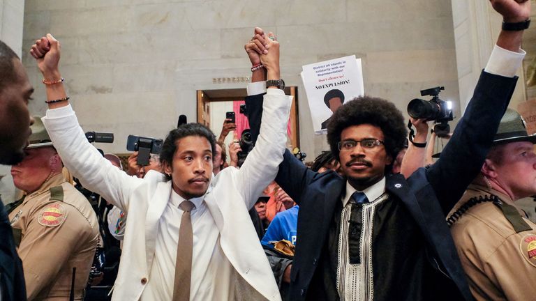 Justin Pearson and Justin Jones raise their hands after being expelled from their seats in Nashville, Tennessee,  