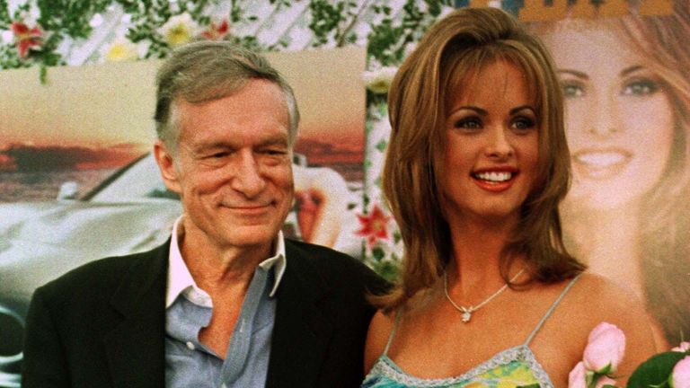Ms McDougal with Hugh Hefner being awarded Playmate of the Year 1998