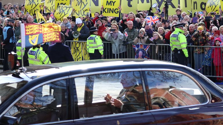 King Charles sits in the car as anti-monarchy protestors demonstrate near the York Minster in York, Britain, April 6, 2023. REUTERS/Phil Noble

