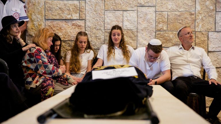 Lucy Dee&#39;s three children (middle) and her husband (right) at her funeral