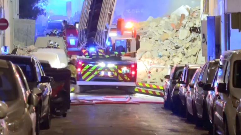 A fire truck next to one of the collapsed buildings. Pic: BFMTV/via Reuters