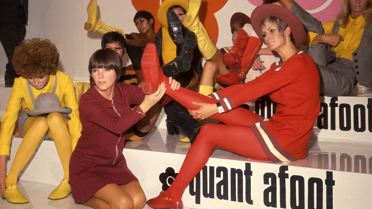 File photo dated 01/08/67 of models showing off their footwear with fashion designer Mary Quant (kneeling)