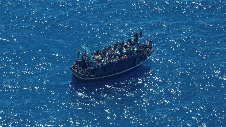 The boat in distress with about 400 people on board is pictured in Central Mediterranean
Pic:Sea-Watch/Reuters
