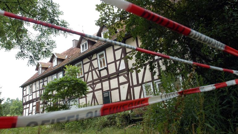 A view of the home of self-declared cannibal Armin Meiwes, sealed off by police following his arrest, in Rotenburg, Germany, 22 July 2003, Pic: AP