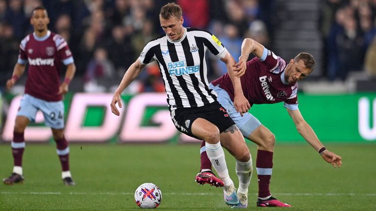 Newcastle United&#39;s Dan Burn in action with West Ham United&#39;s Tomas Soucek