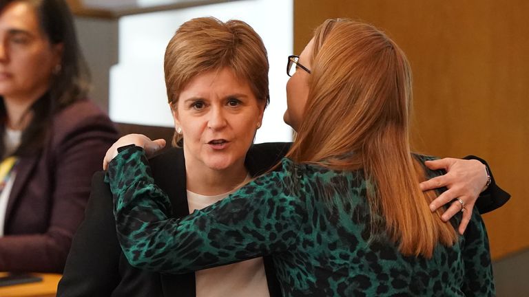 Former Scottish first minister Nicola Sturgeon is hugged by Shirley-Anne Somerville in the main chamber of the Scottish Parliament in Edinburgh. Her husband, former chief executive of the SNP Peter Murrell was arrested earlier this month by police investigating the SNPs finances, and questioned for more than 11 hours before being released pending further investigation. Picture date: Tuesday April 25, 2023.
