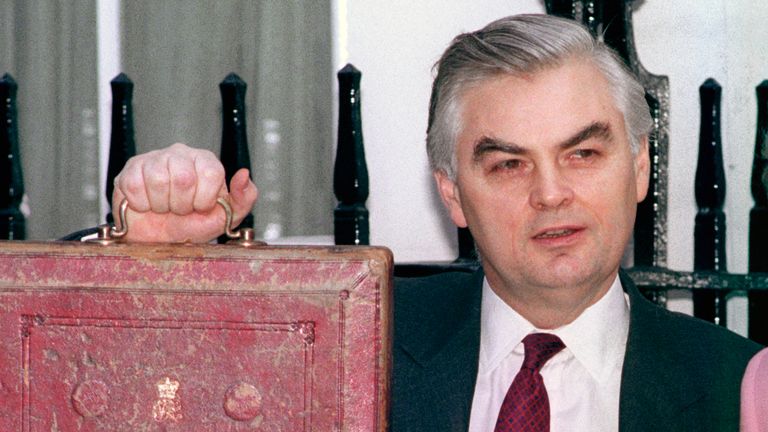 Norman Lamont, Chancellor of the Exchequer, holds the Budget box aloft as he leaves 11 Downing Street with his wife, Rosemary, for the House of Commons. 
