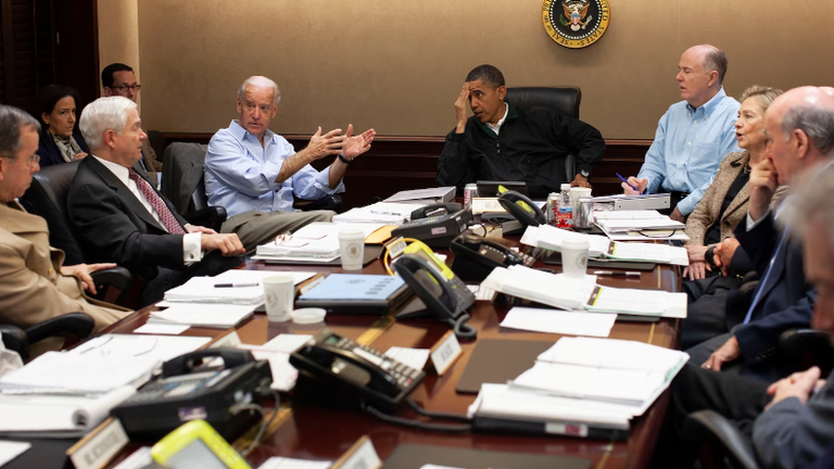 President Barack Obama, top of the table, is joined by members of his national security team including Vice President Joe Biden, top left, and Secretary of State Hillary Clinton, third from right. Pic: Obama Presidential Library

at t President Barack Obama, national security adviser Tom Donilon, Secretary of State Hillary Clinton and White House Chief of Staff Bill Daley.