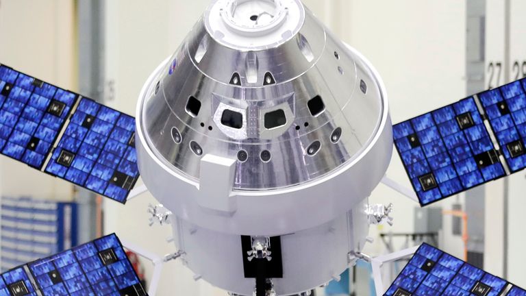 FILE - A model of the Orion capsule and the service module is displayed at the Kennedy Space Center in Cape Canaveral, Fla., on Friday, Nov. 16, 2018. On Monday, April 3, 2023, NASA revealed the identities of the four astronauts ... three US and one Canadian... who will fly around the moon in late 2024. It's the first moon crew in more than 50 years. (AP Photo/John Raoux)