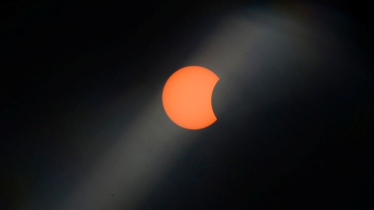 A hybrid solar eclipse is observed with the use of a solar filter at the great mosque area in Padang, West Sumatra province, Indonesia, April 20, 2023, in this photo taken by Antara Foto. Antara Foto/Iggoy el Fitra/via REUTERS ATTENTION EDITORS - THIS IMAGE HAS BEEN SUPPLIED BY A THIRD PARTY. MANDATORY CREDIT. INDONESIA OUT. NO COMMERCIAL OR EDITORIAL SALES IN INDONESIA.
