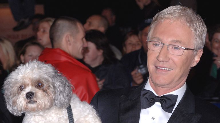 File photo dated 25/10/05 of Paul O&#39;Grady and his dog Buster arriving for the National Television Awards 2005 (NTA), at the Royal Albert Hall, central London. TV presenter and comedian Paul O&#39;Grady has died at the age of 67, his partner Andre Portasio has said. The TV star, also known for his drag queen persona Lily Savage, died "unexpectedly but peacefully" on Tuesday evening, a statement shared with the PA news agency via a representative said. Issue date: Wednesday March 29, 2023.