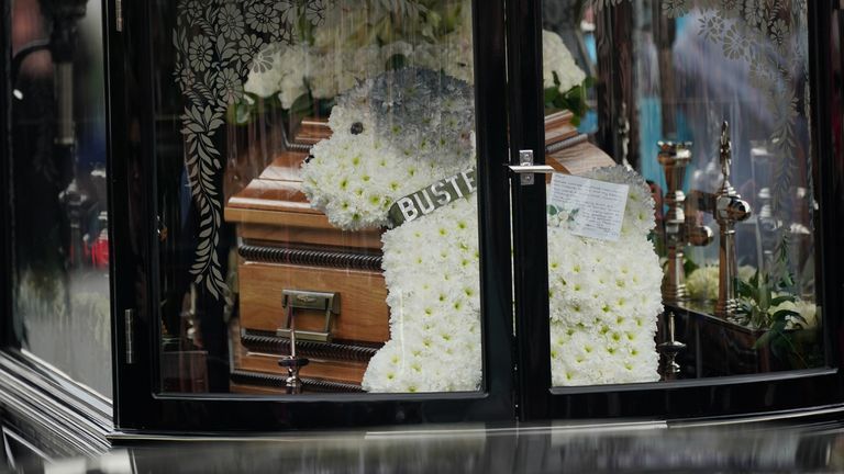 Floral tributes to Paul O&#39;Grady, in the shape of his beloved dog Buster, at this funeral procession in Aldington, Kent