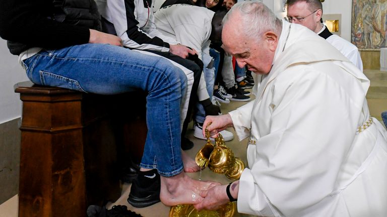 In this picture made available by Vatican Media Pope Francis washes the feet of the inmates of Rome&#39;s penitentiary of Casal del Marmo, Thursday, April 6, 2023. In a Holy Thursday ritual symbolizing humility, Pope Francis washed and wiped dry the bare feet of a dozen residents of a Rome juvenile prison, assuring them of their dignity and telling them "any of us" can fall into sin. (Vatican Media handout via AP