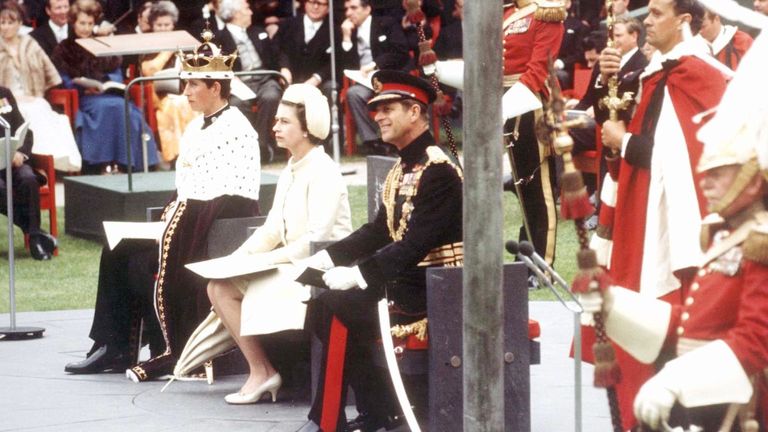 The Queen (centre) her son Prince Charles (left) and her husband the Duke of Edinburgh during the investiture ceremony of Prince Charles as the Prince of Wales at Caernarfon Castle.