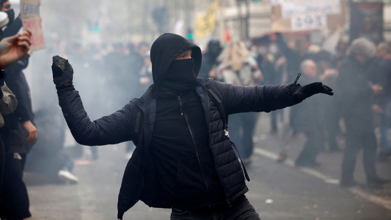 A protester throws a stone during clashes at a demonstration as part of the eleventh day of nationwide strikes and protests against French government&#39;s pension reform, in Paris, France, April 6, 2023. REUTERS/Sarah Meyssonnier

