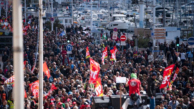 Protesters march during a demonstration in Marseille, southern France ,Thursday, April 13, 2023. French unions are staging new nationwide protests Thursday, on the eve of an expected ruling by a top constitutional body that they hope will derail President Emmanuel Macron&#39;s unpopular pension reform plan. (AP Photo/Daniel Cole)