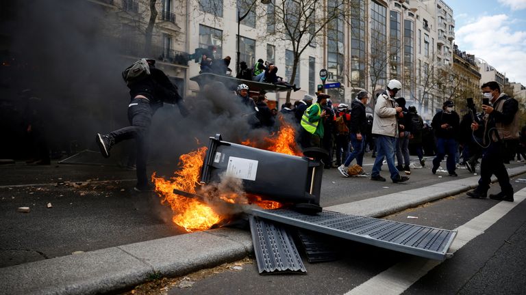 Protesters set garbage bins on fire during clashes at a demonstration as part of the eleventh day of nationwide strikes and protests against french government's pension reform, in paris, france, april 6, 2023. Reuters/sarah meyssonnier